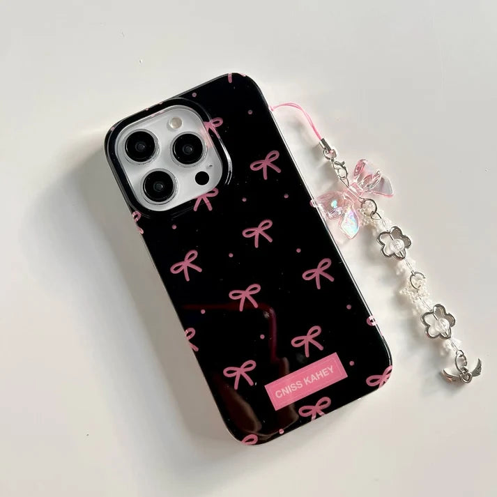 elegant phone case features a glossy black finish with cute pink bow prints with charm